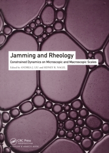 Jamming and Rheology : Constrained Dynamics on Microscopic and Macroscopic Scales