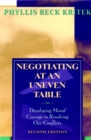 Negotiating at an Uneven Table : Developing Moral Courage in Resolving Our Conflicts - Book