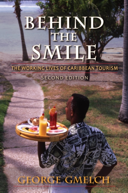 Behind the Smile, Second Edition : The Working Lives of Caribbean Tourism, Paperback / softback Book