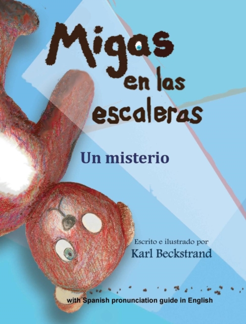 Migas en las escaleras : Un misterio (with pronunciation guide in English), Hardback Book