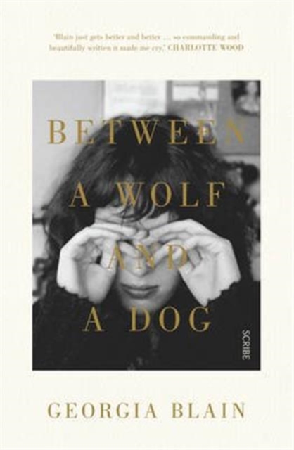 Between a Wolf and a Dog, Paperback / softback Book